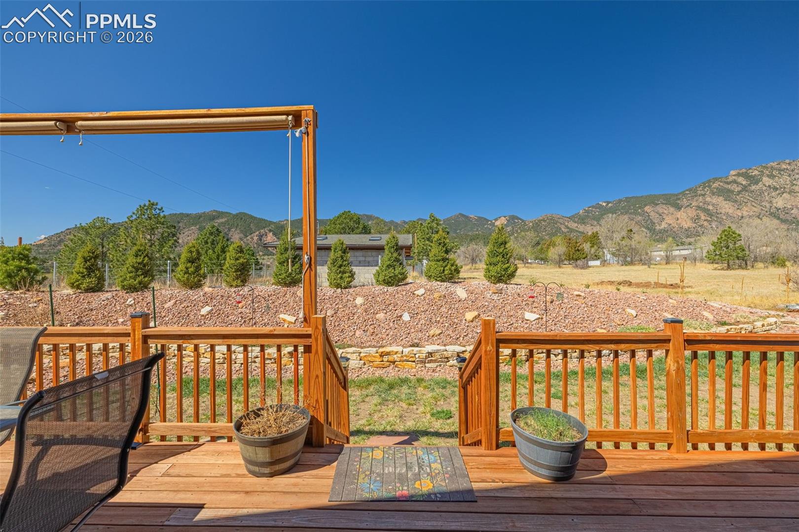 8480 Delaware Road Colorado Springs, CO 80926 - Photo 31 of 50 Wooden deck featuring a mountain view