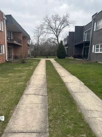 a view of house with yard