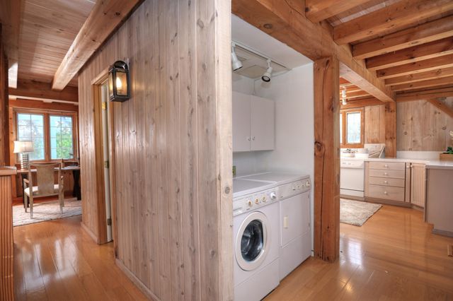 a view of hallway with washer and dryer