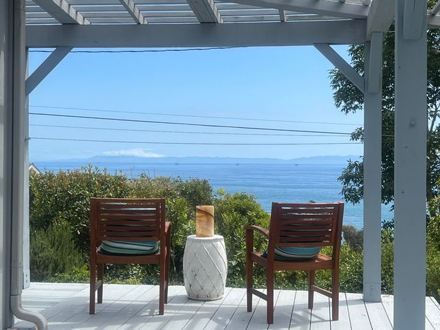 a view of a chairs and table on the terrace
