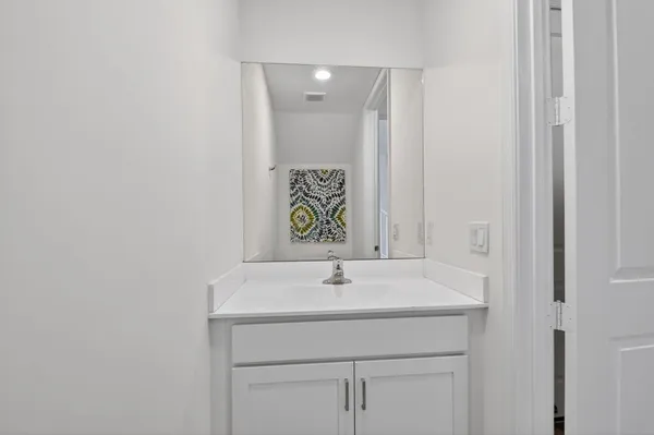 a sink with a mirror