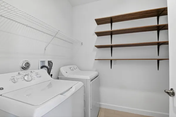 a utility room with dryer and washer