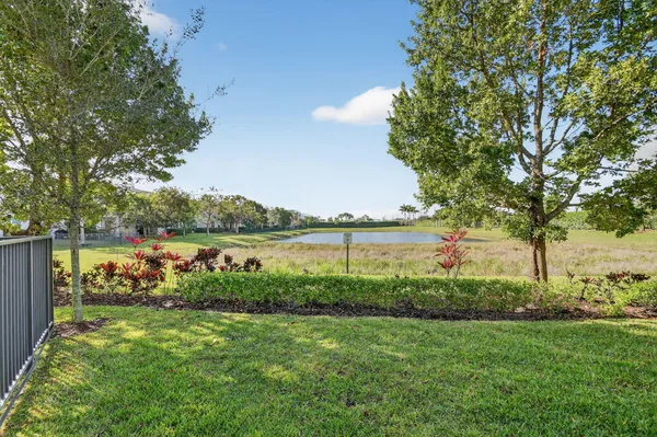 a view of lake with a big yard