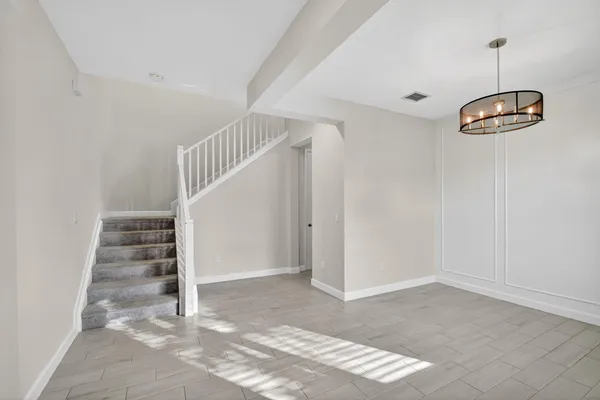 a view of a hallway with staircase