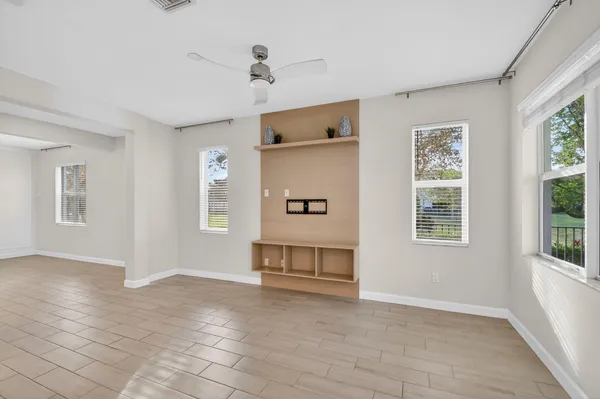 a view of livingroom with hardwood floor and a ceiling fan
