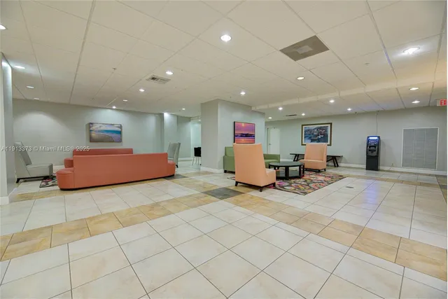 a view of a room with gym equipment and a large window