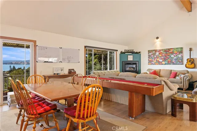 a dining room with a table and chairs