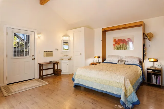 a bedroom with a bed and a table