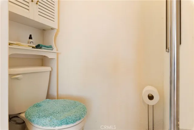 a bathroom with a toilet and a sink