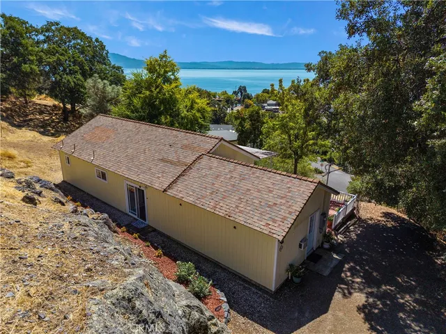 a view of a barn in the middle of a yard