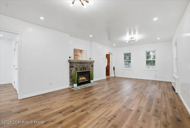 a kitchen with granite countertop a sink stainless steel appliances and cabinets
