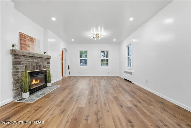 a kitchen with stainless steel appliances granite countertop a sink stove and microwave
