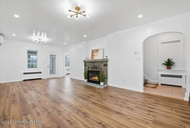 a kitchen with stainless steel appliances granite countertop a stove and a refrigerator