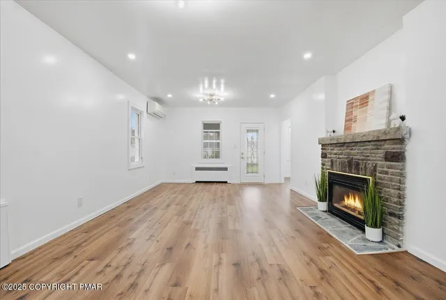 a kitchen with stainless steel appliances granite countertop a stove microwave and refrigerator