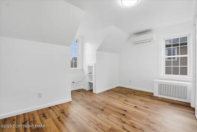 a view of a house with patio and a yard