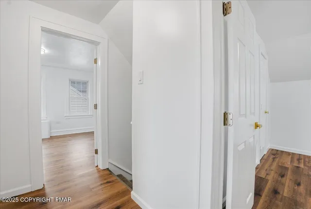 a aerial view of a house with garden and trees