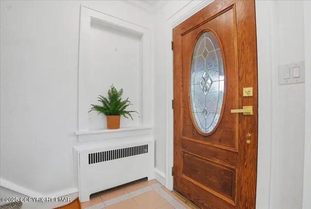 a aerial view of a house next to a yard