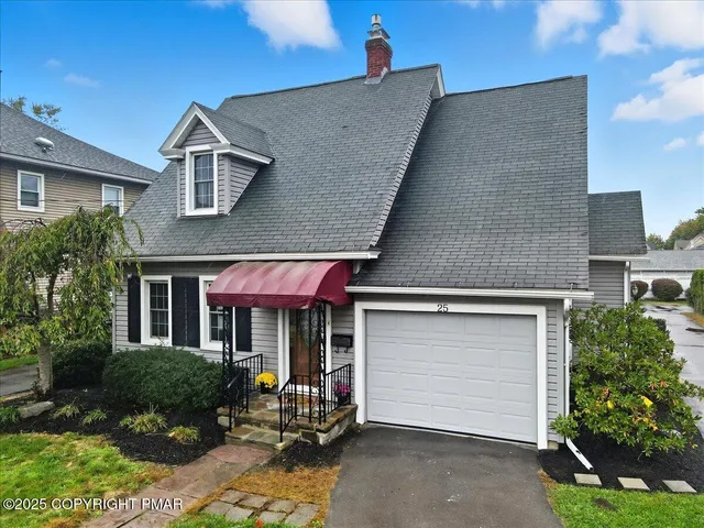 a front view of a house with yard