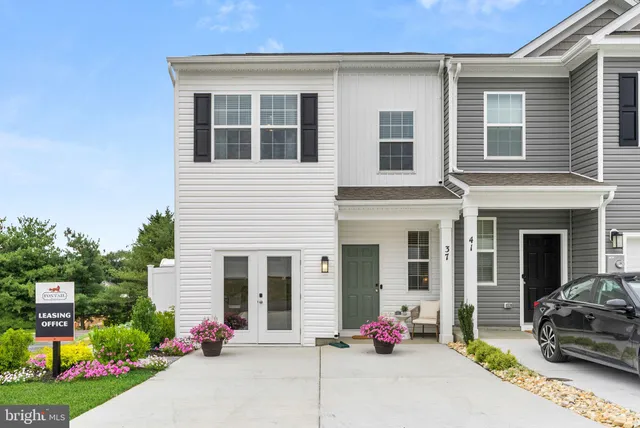 a view of multiple houses with a city street