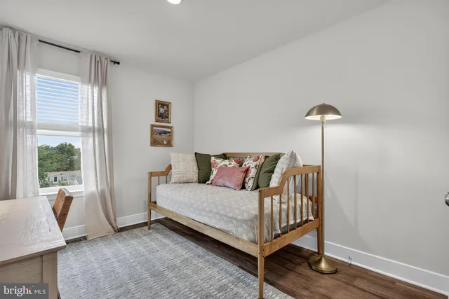 a bedroom with a bed and a table