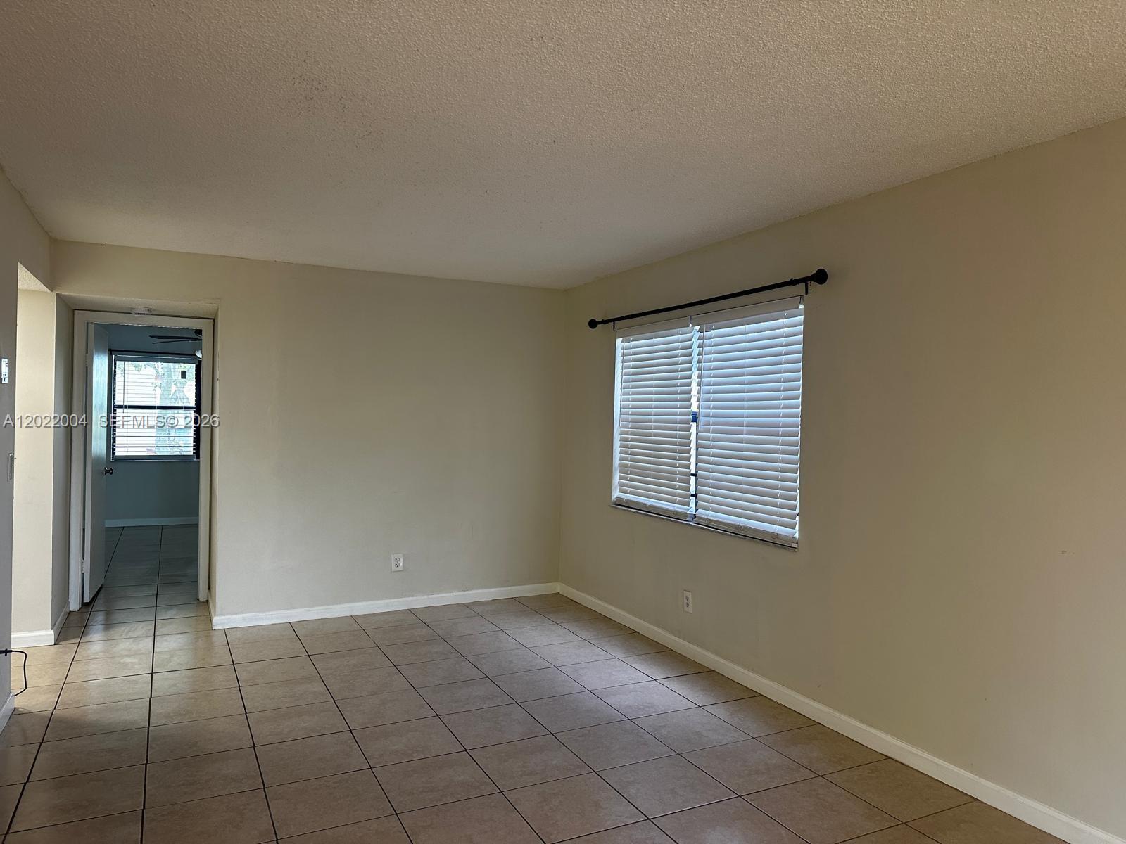 3400 Foxcroft Road, Unit 301 Miramar, FL 33025 - Photo 39 of 72 an empty room with windows