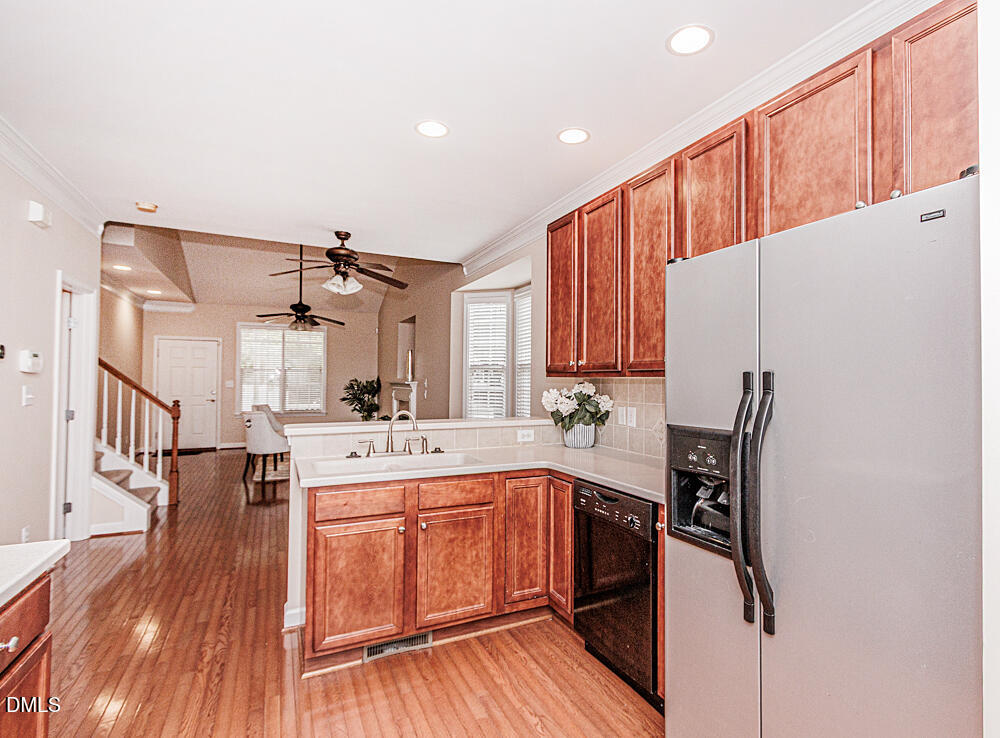 6016 Four Townes Lane Raleigh, NC 27616 - Photo 13 of 32 a kitchen with a sink appliances and cabinets