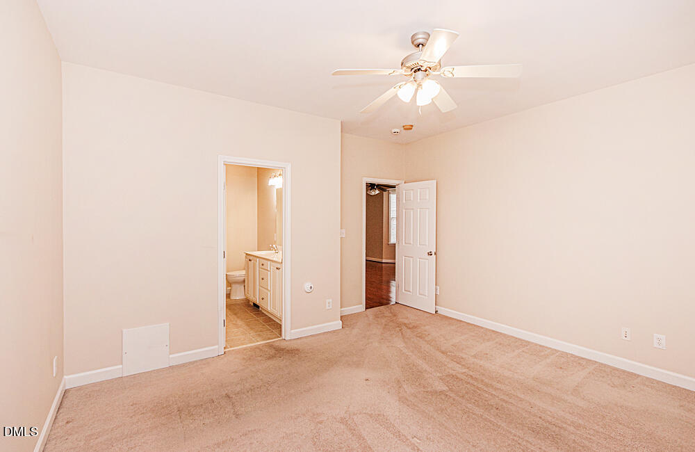 6016 Four Townes Lane Raleigh, NC 27616 - Photo 16 of 32 a view of a room with a ceiling fan and a window