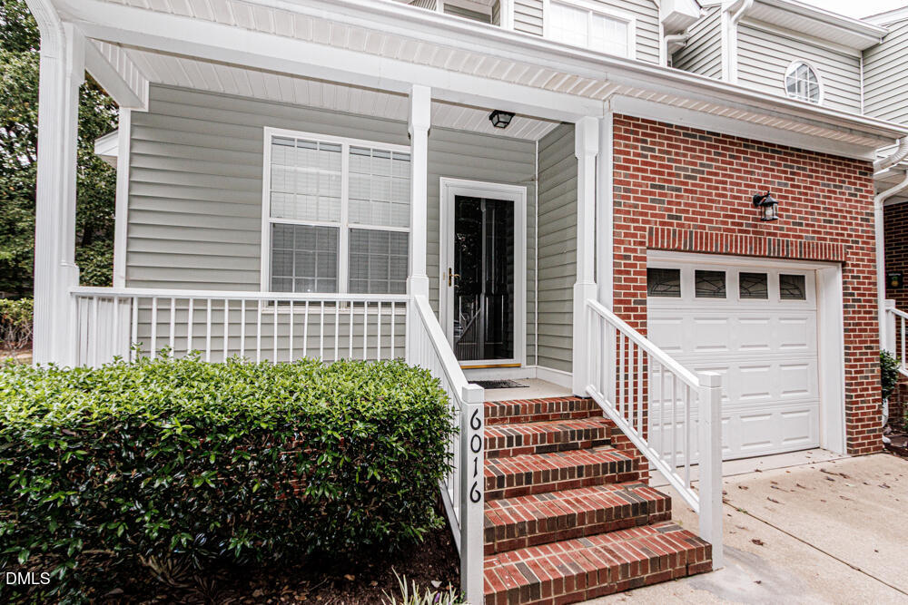 6016 Four Townes Lane Raleigh, NC 27616 - Photo 2 of 32 a front view of a house with a balcony