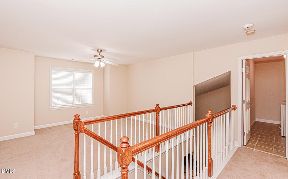 6016 Four Townes Lane Raleigh, NC 27616 - Photo 22 of 32 a view of a hallway view with staircase