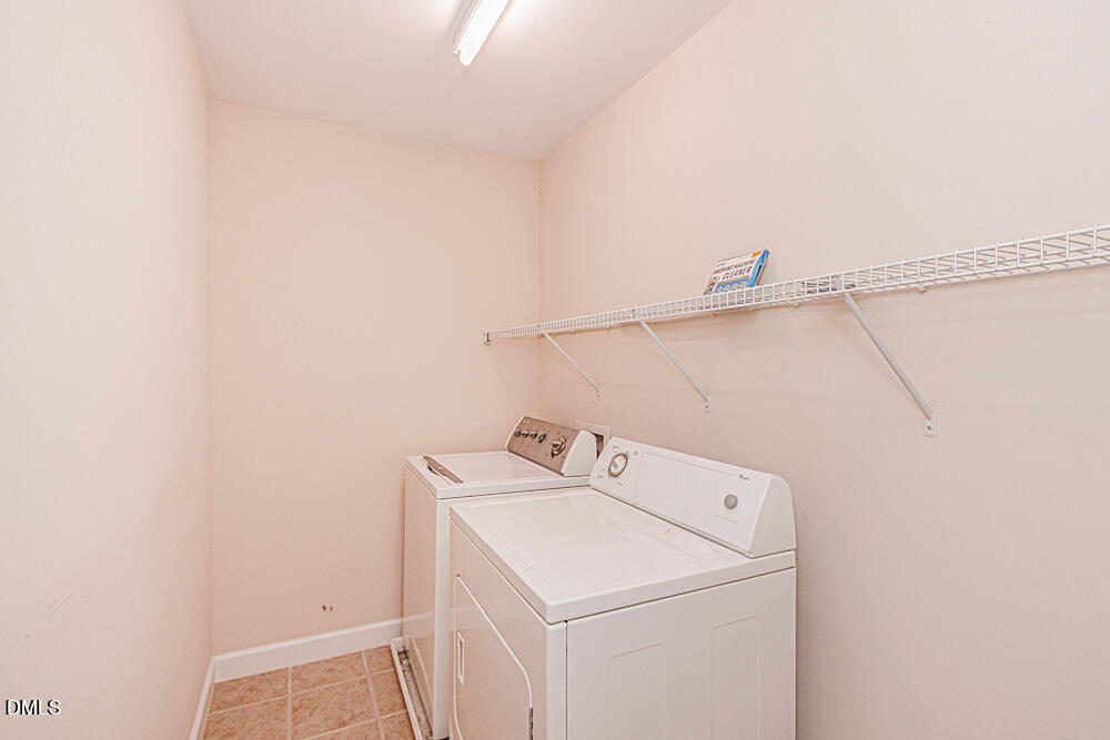 6016 Four Townes Lane Raleigh, NC 27616 - Photo 23 of 32 a utility room with dryer and washer