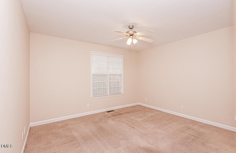6016 Four Townes Lane Raleigh, NC 27616 - Photo 24 of 32 an empty room with a window