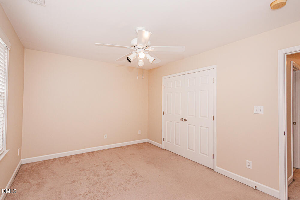 6016 Four Townes Lane Raleigh, NC 27616 - Photo 26 of 32 an empty room with a window