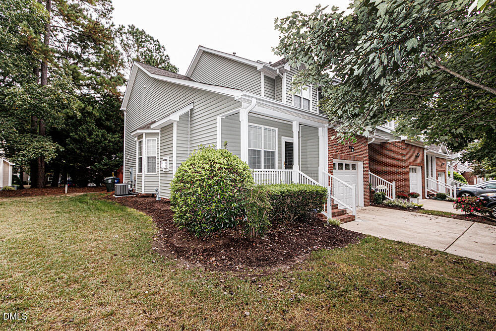 6016 Four Townes Lane Raleigh, NC 27616 - Photo 3 of 32 a front view of a house with garden