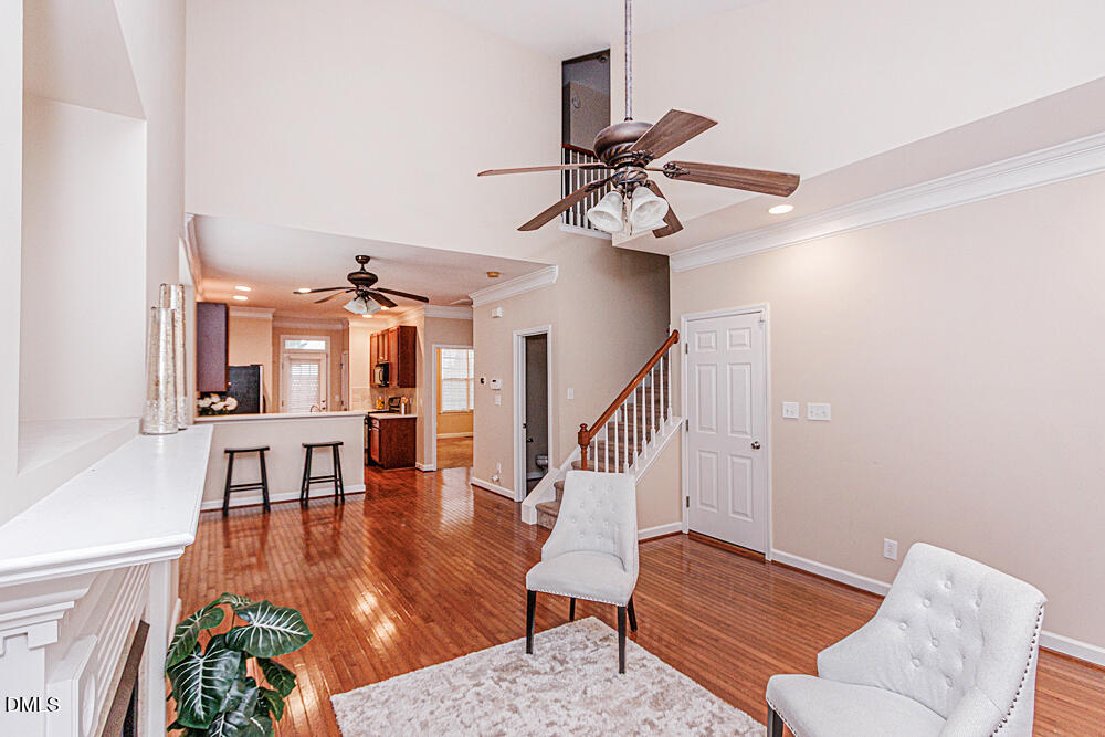 6016 Four Townes Lane Raleigh, NC 27616 - Photo 4 of 32 a living room with furniture and wooden floor