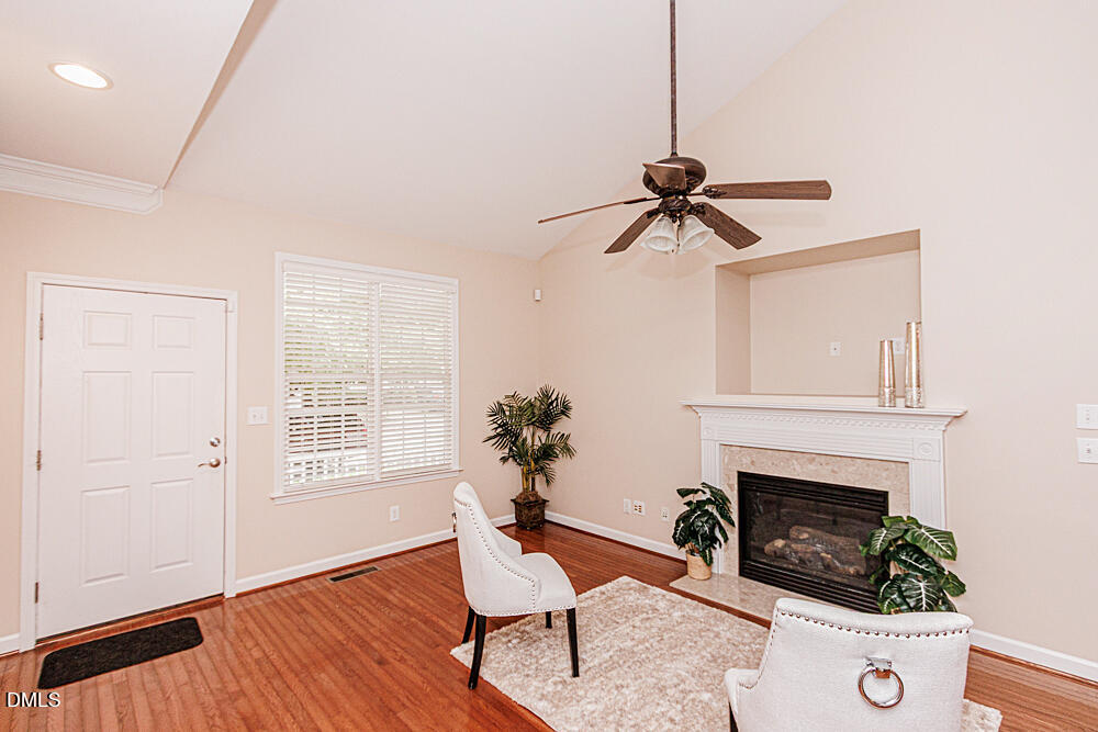 6016 Four Townes Lane Raleigh, NC 27616 - Photo 6 of 32 a living room with furniture and a fireplace