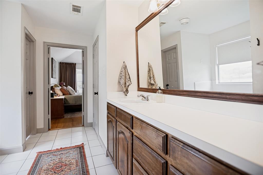 5643 West Caylor Road Fort Worth, TX 76244 - Photo 19 of 37 Double vanity with integral sinks and a white countertop