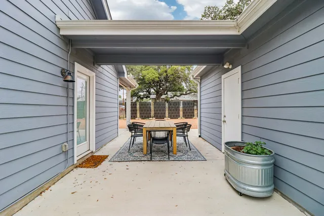 a view of a house with large space and large trees
