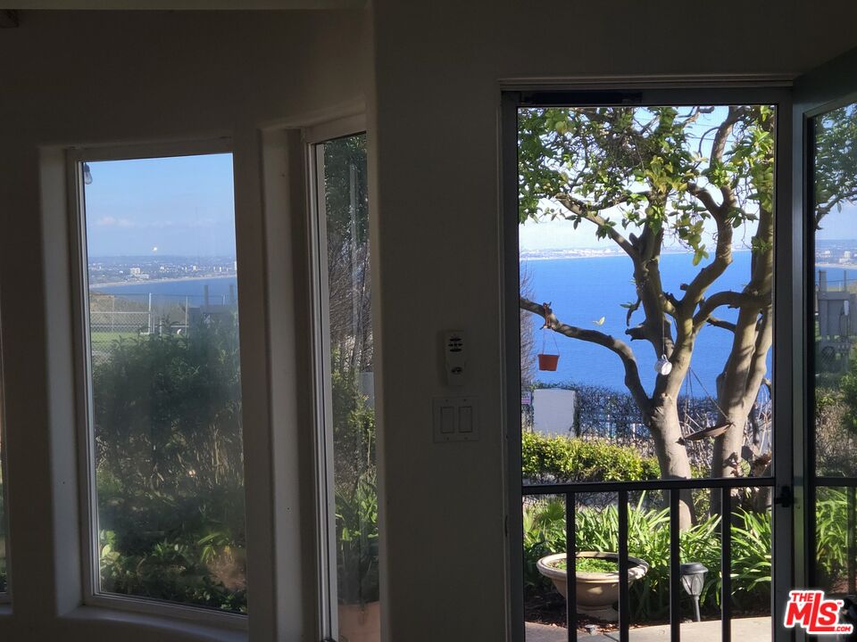 20776 Big Rock Drive Malibu, CA 90265 - Photo 11 of 67 a view of a glass door and a yard from a window