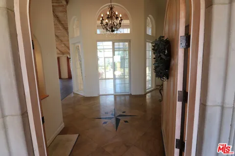 a room with window and furniture