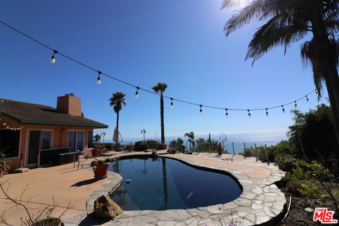 20776 Big Rock Drive Malibu, CA 90265 - Photo 43 of 67 a view of a swimming pool with a patio