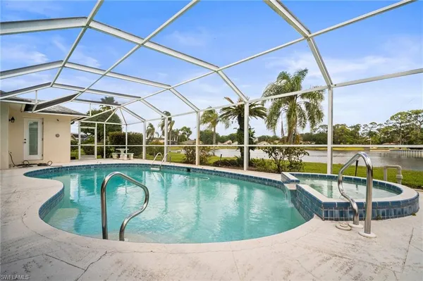 a view of a swimming pool with a patio
