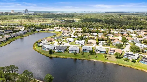 an aerial view of a house with a ocean view