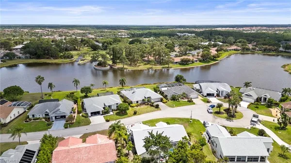 an aerial view of a house with a lake view