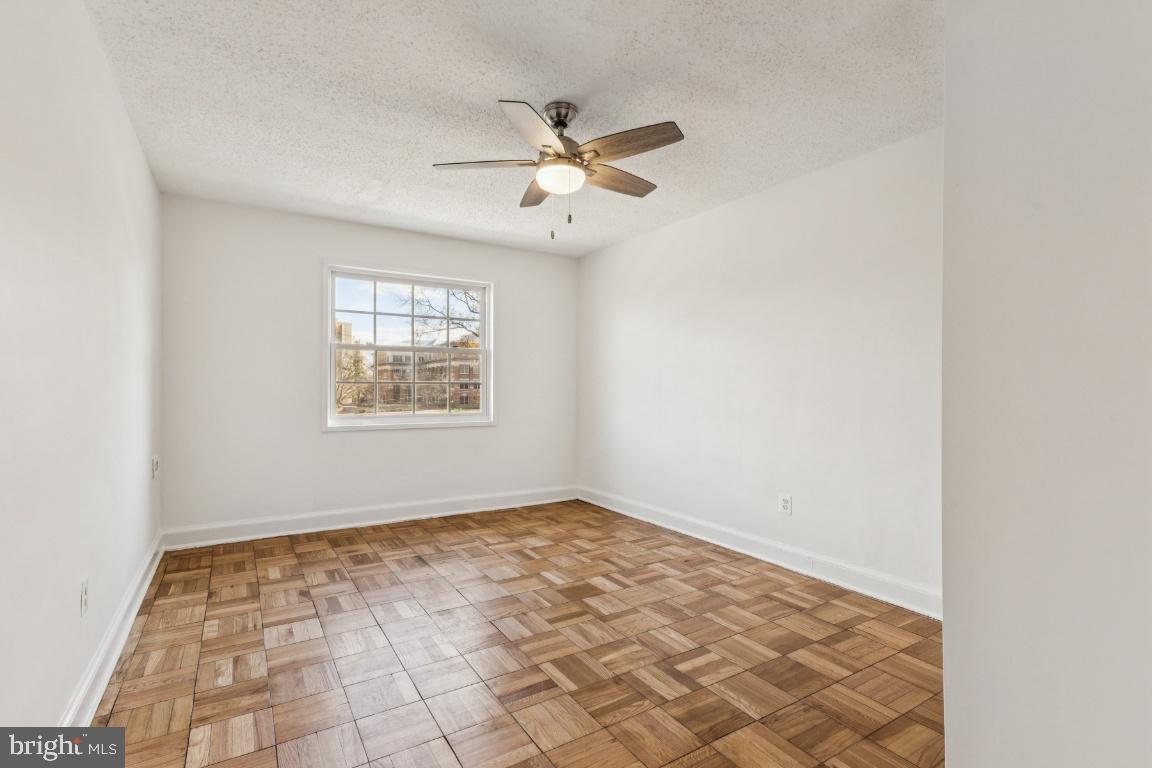 1620 West Abingdon Drive, Unit 301 Alexandria, VA 22314 - Photo 14 of 24 an empty room with windows and fan