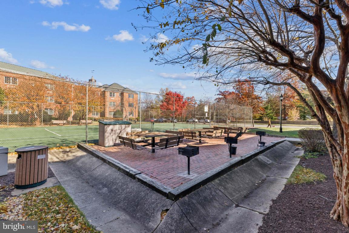 1620 West Abingdon Drive, Unit 301 Alexandria, VA 22314 - Photo 18 of 24 a view of a patio with a yard