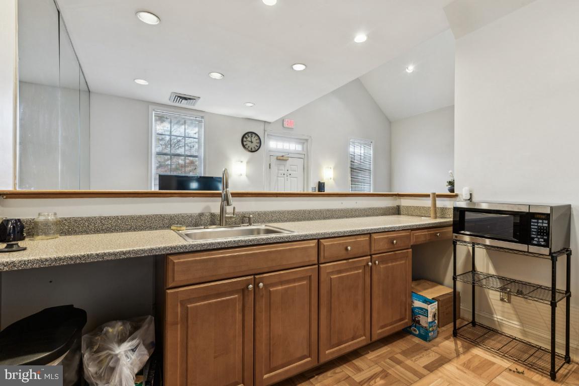 1620 West Abingdon Drive, Unit 301 Alexandria, VA 22314 - Photo 22 of 24 a bathroom with a sink and a toilet