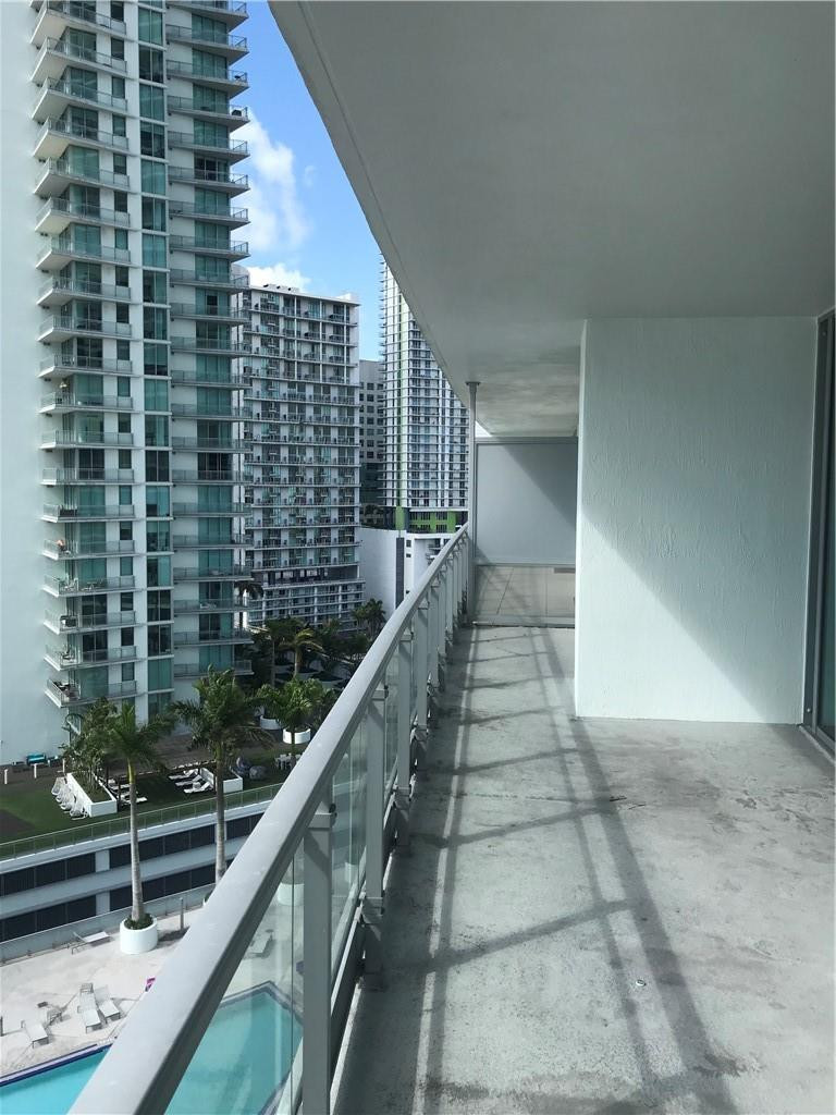 90 Southwest 3rd Street, Unit 1802 Miami, FL 33130 - Photo 24 of 50 a view of balcony with wooden floor and fence