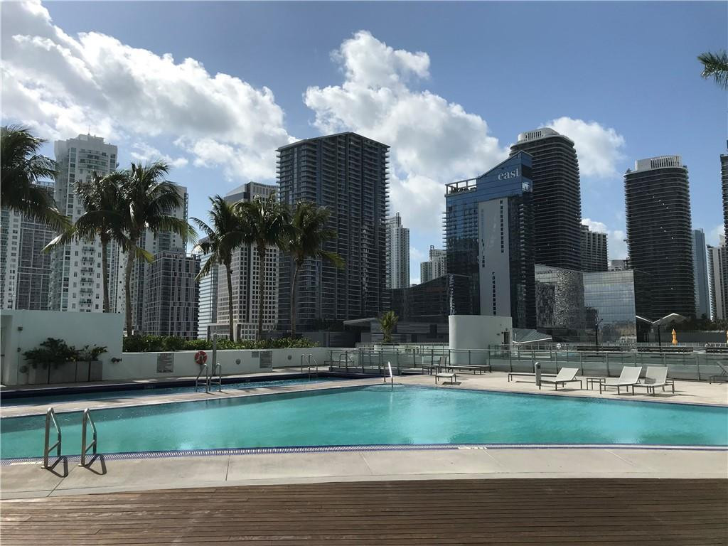 90 Southwest 3rd Street, Unit 1802 Miami, FL 33130 - Photo 31 of 50 a backyard of a house with barbeque oven and outdoor seating