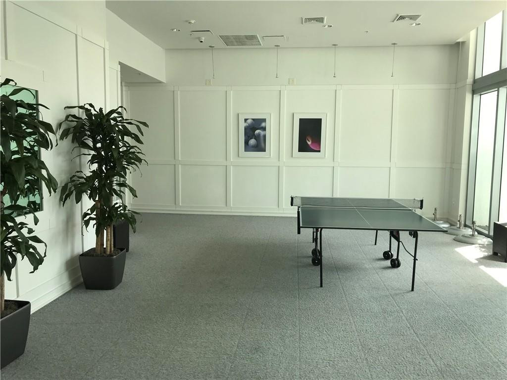 90 Southwest 3rd Street, Unit 1802 Miami, FL 33130 - Photo 36 of 50 a living room with furniture and a potted plant