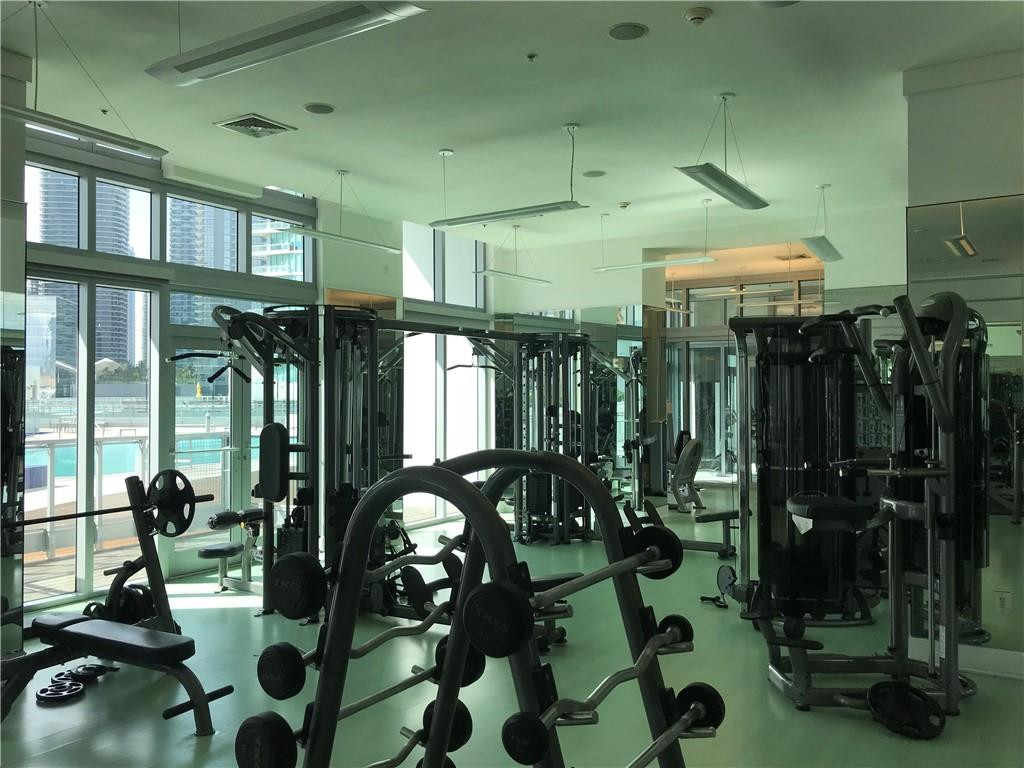 90 Southwest 3rd Street, Unit 1802 Miami, FL 33130 - Photo 37 of 50 a room with lots of gym equipment